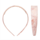 Pink marbled acrylic headband with toothed grip and wide smooth band, shown from front and side view