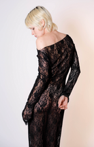 Black lace long-sleeve maxi dress with off-shoulder neckline and sheer floral pattern throughout