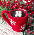 Red felt hot cocoa mug ornament with white snowflakes and marshmallows, hanging loop for Christmas tree decoration