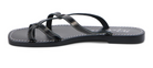 Black leather strappy sandal with white contrast stitching and flat sole, shown from side angle