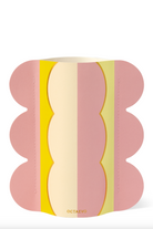Pink yoga block with yellow and cream striped pattern and wavy scalloped edges, branded Octaevo