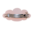 Cloud-shaped pink acrylic hair barrette with silver metal clasp, shown from back view