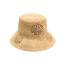 Beige straw bucket hat with shell designs on a white background