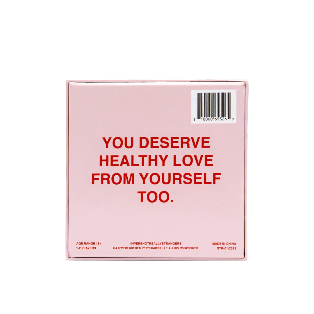 Pink game box with red text reading "YOU DESERVE HEALTHY LOVE FROM YOURSELF TOO" and barcode on top