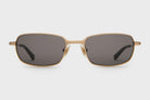 Gold-framed sunglasses with dark lenses on a white background