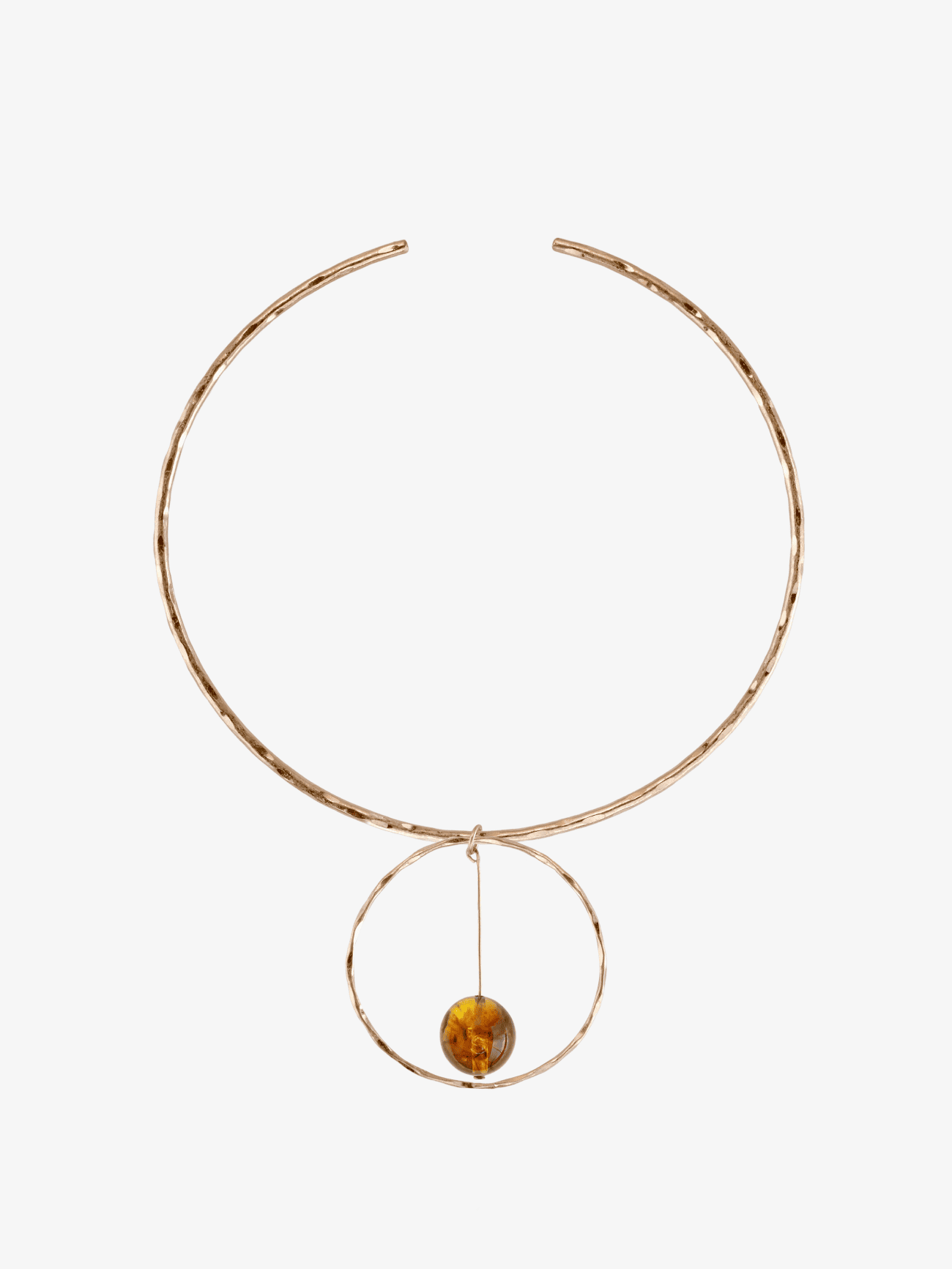 Hammered rose gold collar necklace with circular pendant holding amber bead on white background
