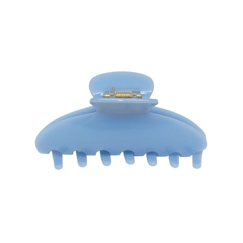 Light blue plastic hair claw clip with metal spring clasp mechanism, featuring curved teeth for secure hold