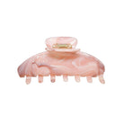 Pink marbled hair claw clip with metal clasp and curved teeth for securing hair