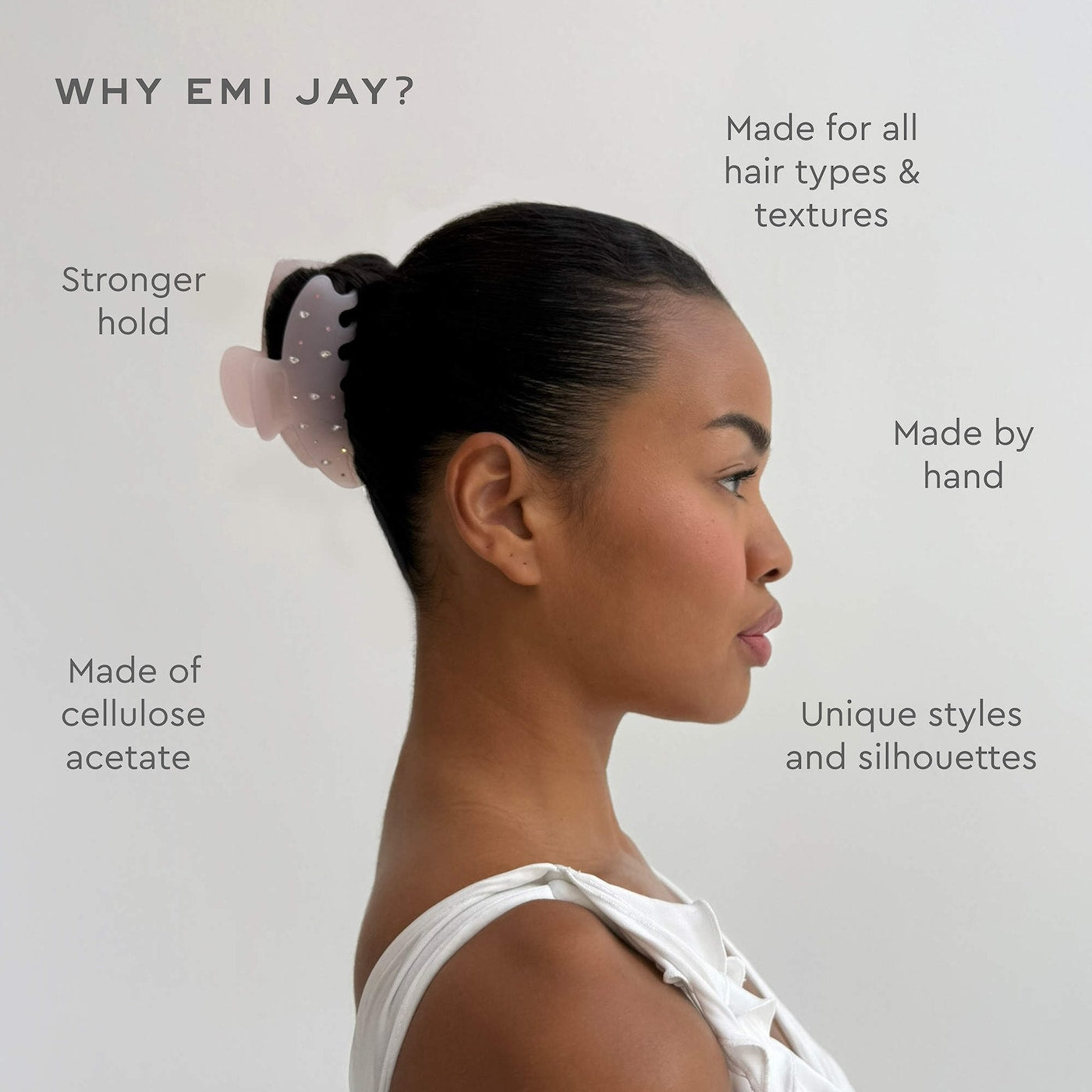 Woman in profile wearing a pink polka dot scrunchie in an updo hairstyle, showcasing EMI JAY hair accessory features