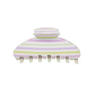 Striped hair claw clip in pastel pink, yellow, and white with seven teeth and dome-shaped top