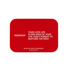 Red rectangular card with white text reading reminder about nurturing all areas of life from We're Not Really Strangers Breakup Edition