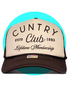 Brown and tan trucker hat with "Cuntry Club ESTD 1983 Lifetime Membership" text on mesh-back foam front panel