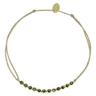 Gold chain bracelet with dark green beads and adjustable sliding clasp closure
