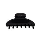 Black plastic hair claw clip with curved design and seven teeth, shown from side profile on white background