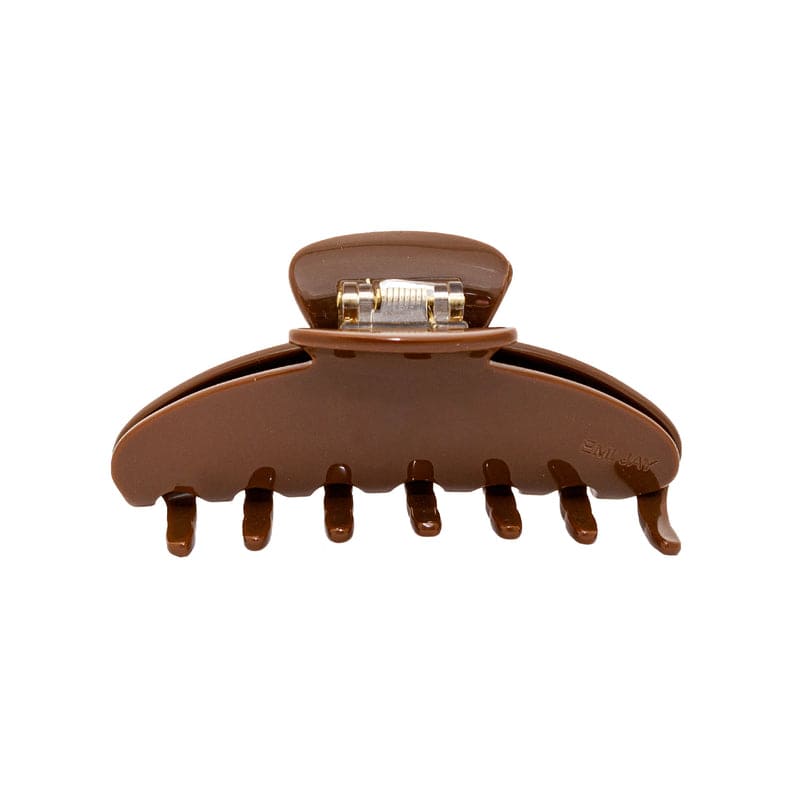 Brown plastic hair claw clip with metal spring clasp mechanism and curved teeth for securing hair