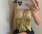 Chartreuse green polka dot cami top with V-neck and delicate straps, shown in mirror selfie with black shorts