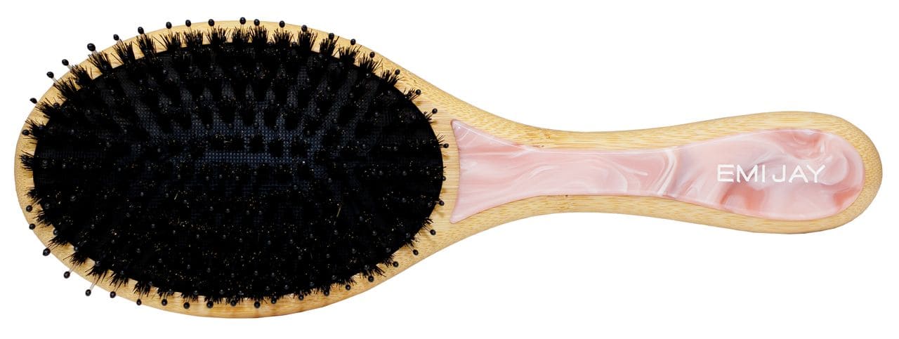 Oval hairbrush with black and natural boar bristles, bamboo frame, and pink marbled acrylic handle with EMI JAY logo