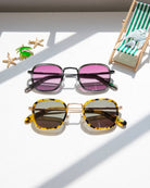 Two pairs of square-frame sunglasses with metal bridges - one with black frames and pink lenses, one with tortoiseshell frames and brown lenses
