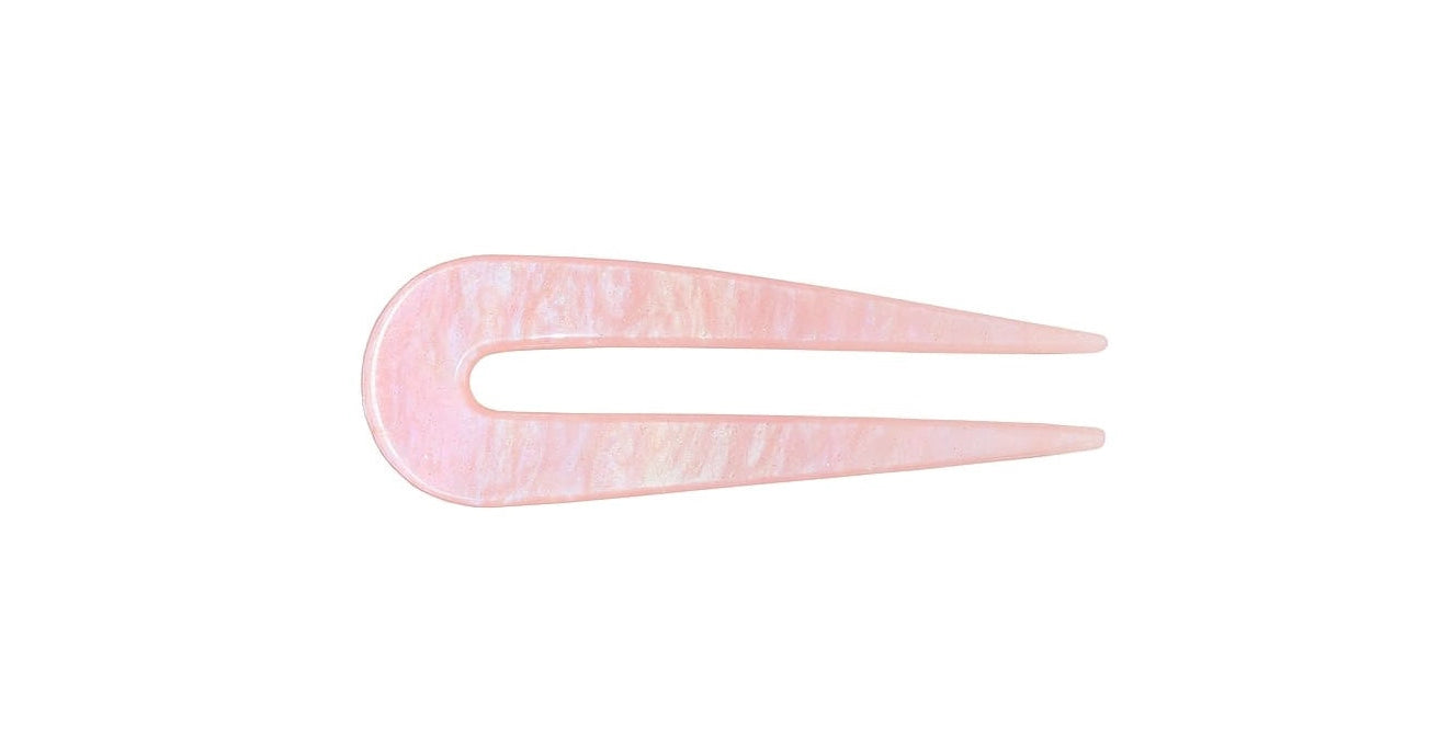Pink hair clip on a white background