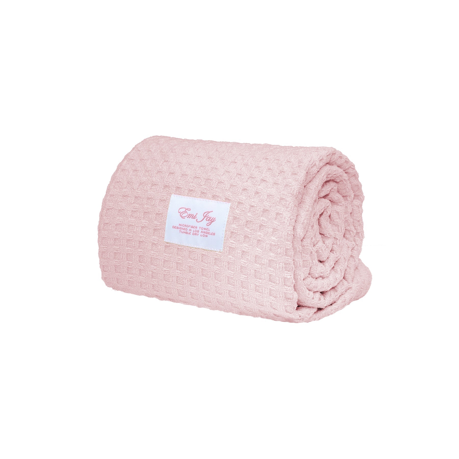 Rolled pink blanket with a label on a white background