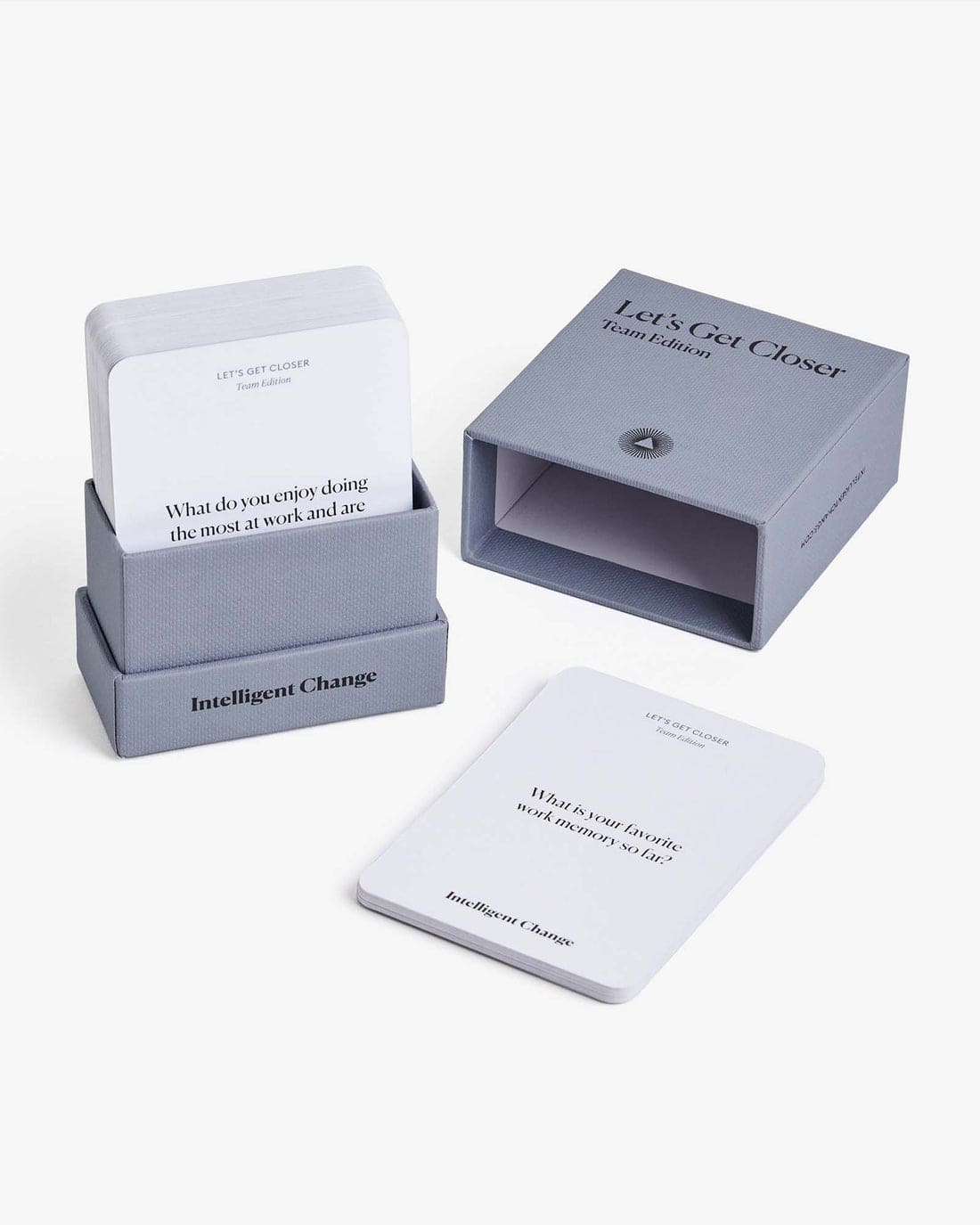 Card deck set with gray box containing white question cards labeled Let's Get Closer Team Edition by Intelligent Change