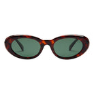 Sunglasses with tortoiseshell frame and green lenses on a white background