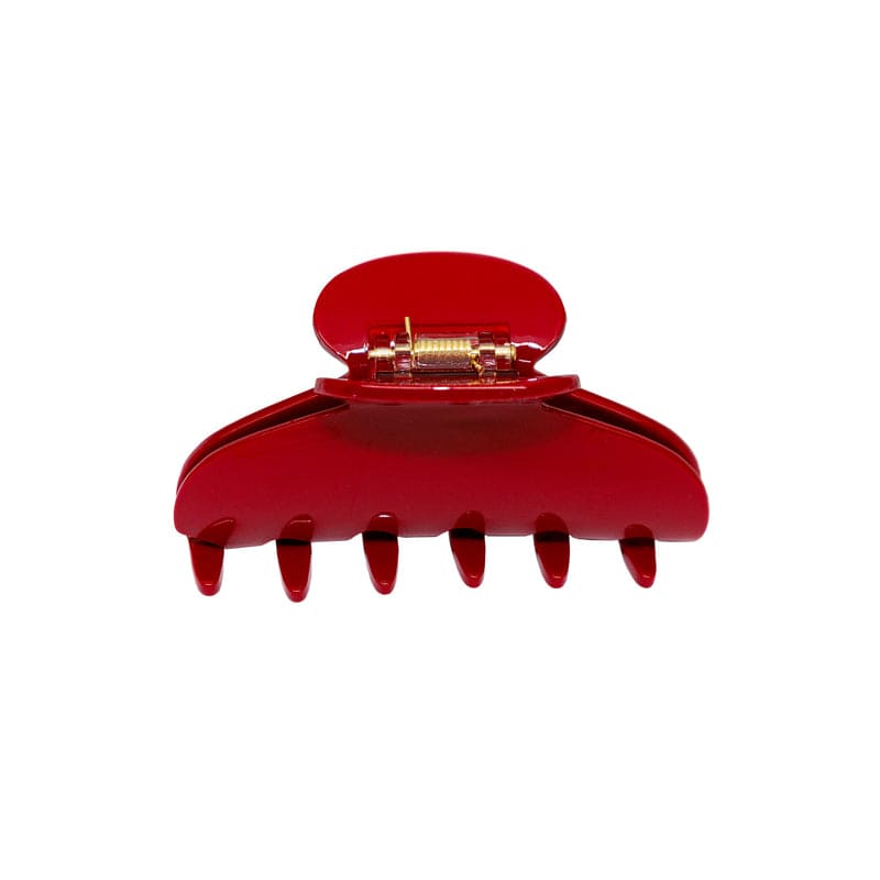 Large red translucent plastic hair claw clip with metal spring mechanism, featuring 6 teeth and rounded top design