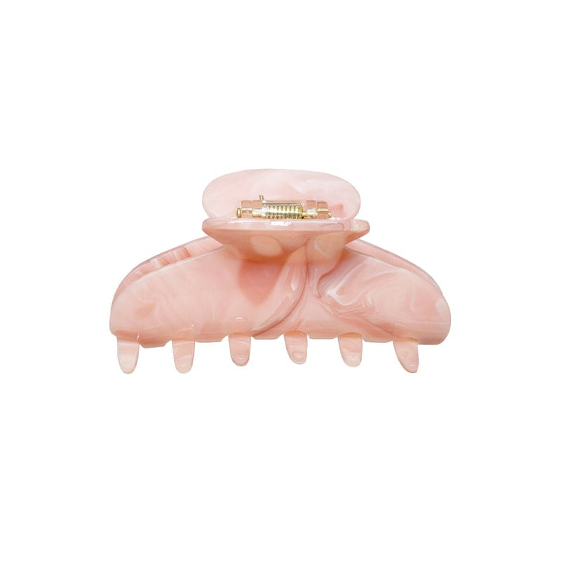 Large pink marbled hair claw clip with gold-tone metal clasp and teeth for securing hair