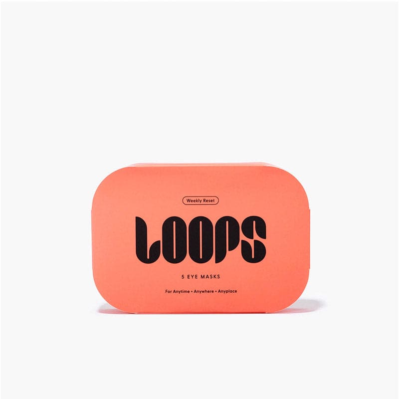 Coral-colored rectangular tin container with black LOOPS typography, containing 5 eye masks for weekly reset skincare routine