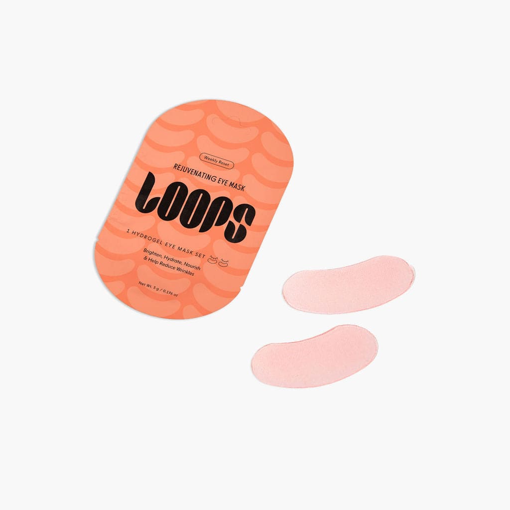 Loons rejuvenating hydrogel eye masks in coral packaging with two pink eye patches displayed beside it