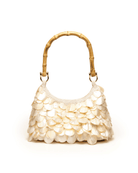 Cream-colored handbag with bamboo handle featuring overlapping mother-of-pearl shell embellishments in a scale pattern