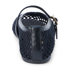 Navy blue crocheted bucket bag with leather trim and top handle, shown from back view against white background