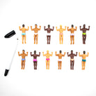 Set of small figurines of men in various poses with a marker on a white background