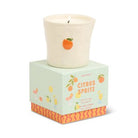 Cream-colored ceramic candle with orange citrus fruit design, displayed on decorative mint green and orange patterned gift box