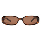 Sunglasses with tortoiseshell frame and brown lenses on a white background