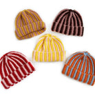 Five ribbed knit beanies in two-tone stripes: yellow-pink, mauve-brown, red-pink, yellow-white, and orange-blue colorways.