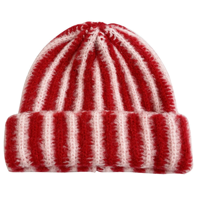 Red and white striped ribbed knit beanie hat with folded cuff, soft fuzzy wool blend, candy cane pattern
