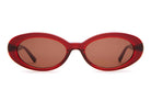 Red oval vintage-style sunglasses with brown tinted lenses and translucent acetate frames on white background