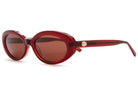 Red translucent oval sunglasses with brown tinted lenses and gold medallion accent on temple arms