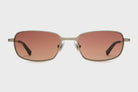 Sunglasses with gold frame and brown lenses on a white background
